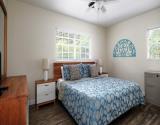Ceiling Fans and Relaxing Colors Provide Easy Rest in Primary Bedroom