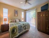 Primary Bedroom with Direct Access to Pool Area.