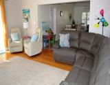 Retire to Spacious Living Room with Comfortable Seating