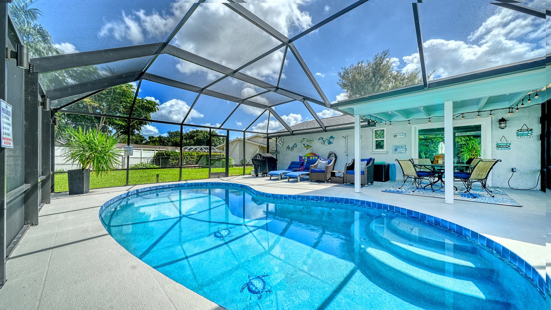 Relax in the sun in the screened oasis